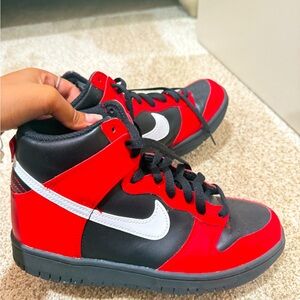 worn a little bit , red and black high top dunks